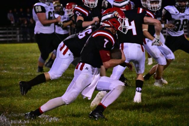 Action was intense at Calhoun on Friday night in the opener against Camp Point. This is one Calhoun running scamper. Photos by Alison Godar.