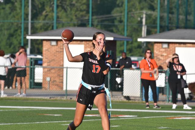 Edwardsville's flag football had its historic start on Tuesday night, Aug. 26, 2025, at EHS. The Tigers' quarterback Ella Wallace prepares to throw in this photo. (Photo by Dan Brannan)