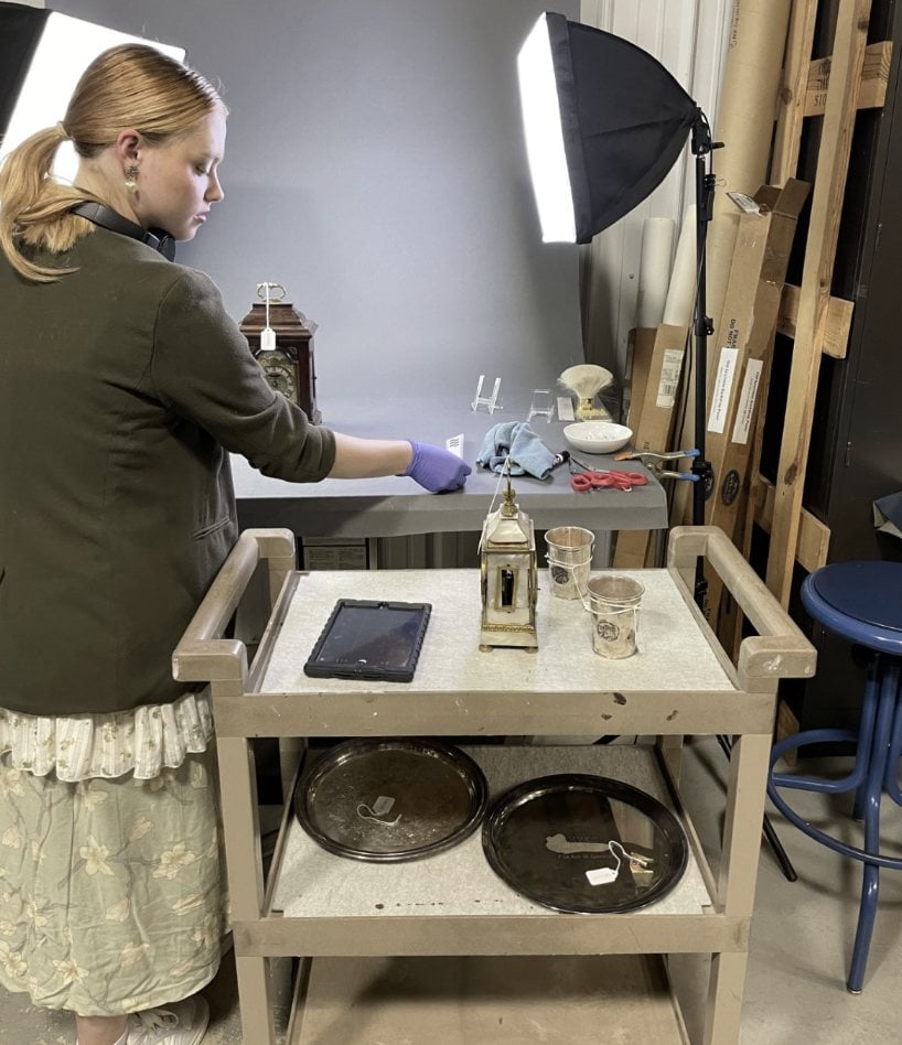 Undergraduate student doing inventory tasks in the museum archive building.