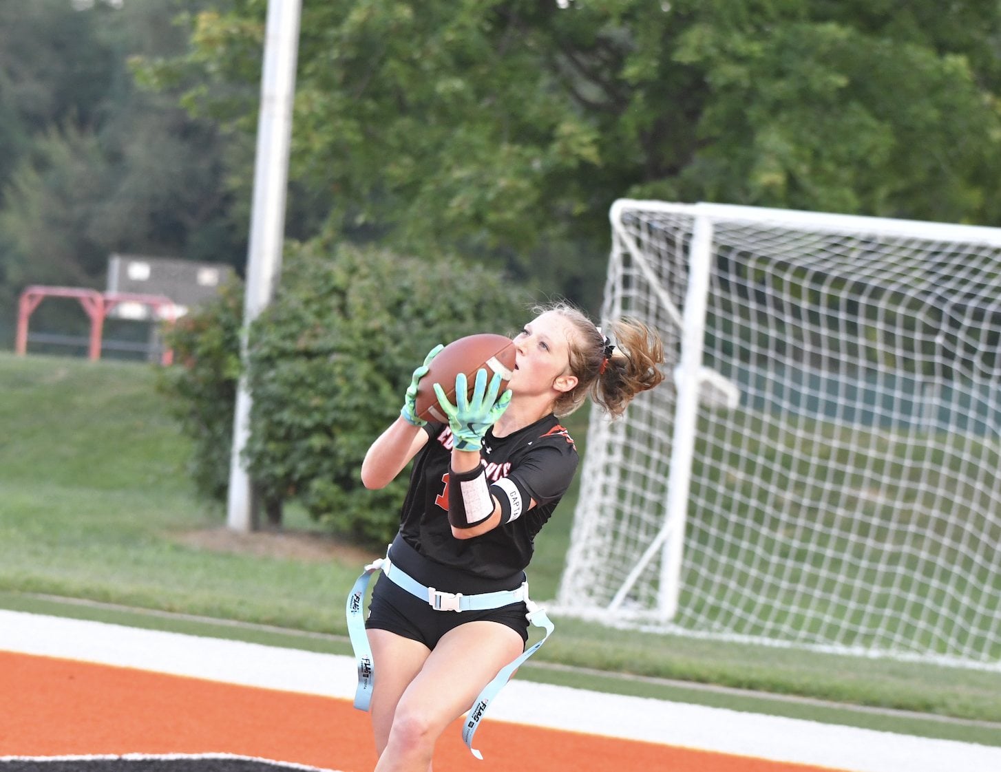 Sophomore Serena Shapiro receives a TD reception on Tuesday against Alton. (Photos by Dan Brannan).