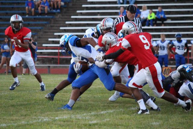 The Alton defense works to take down their opponent. 