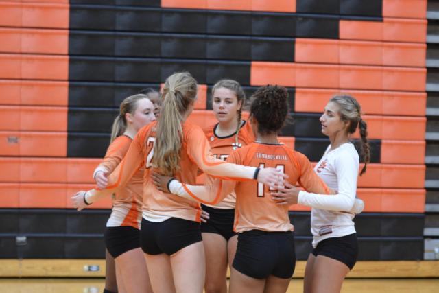 Rachel Pranger, in middle, was MVP of the TIger Classic. Other team members celebrate a key point in the tourney. (Photo by Dan Brannan)