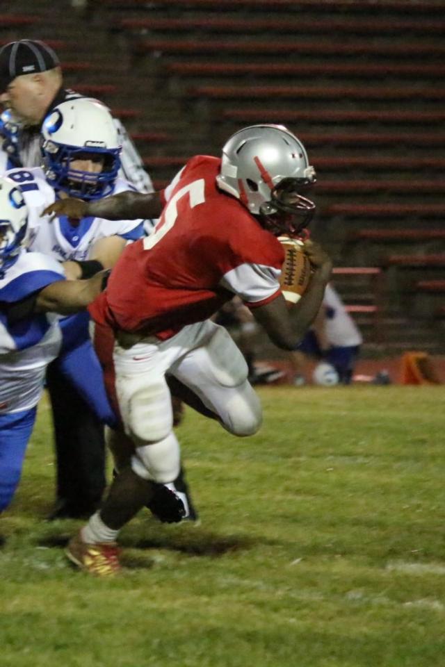 Darrell Smith weaves through the Quincy defense to secure a 71-yard touchdown in the fourth quarter. 