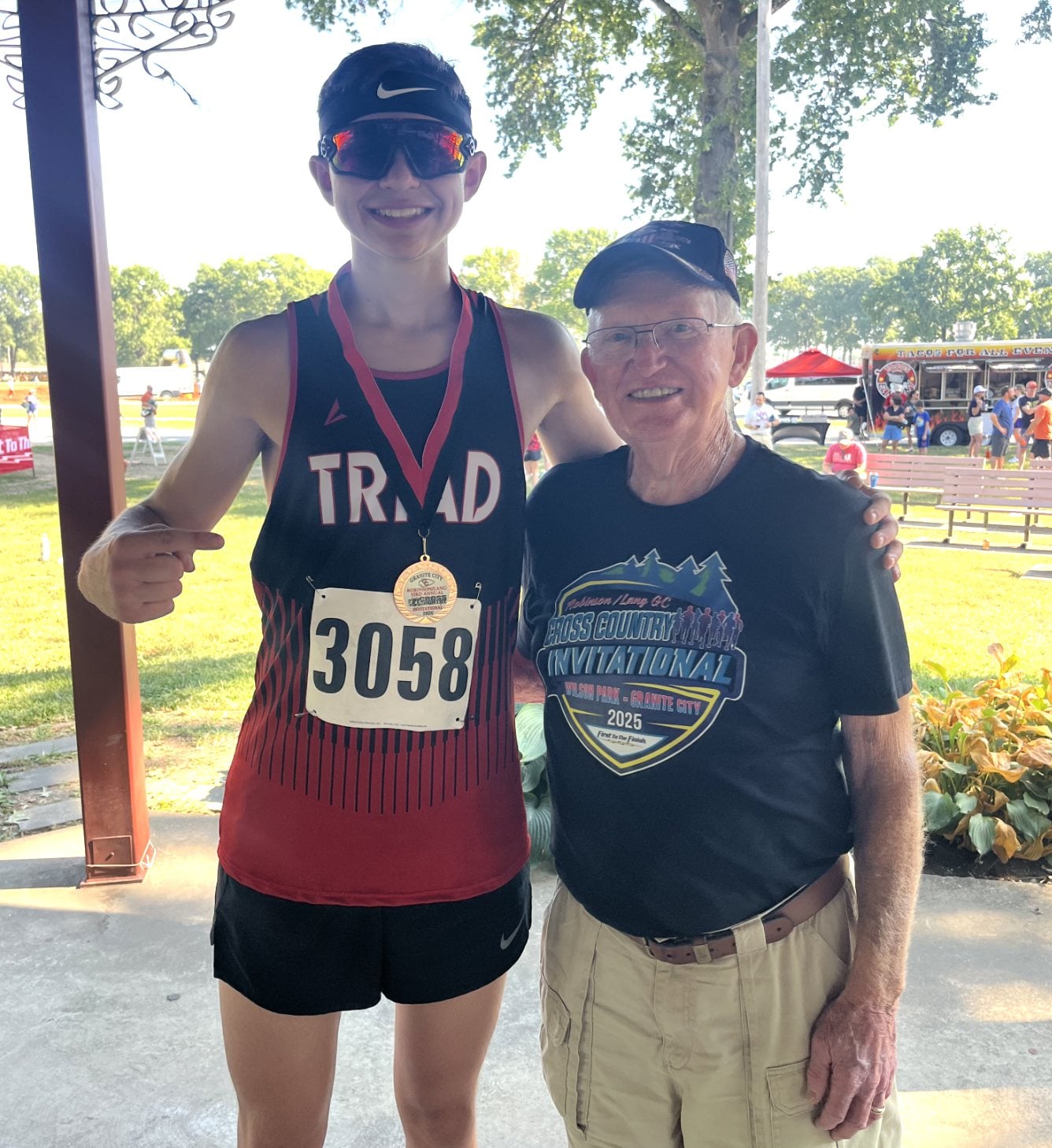 Triad runner Caden Meier and Coach Lang.