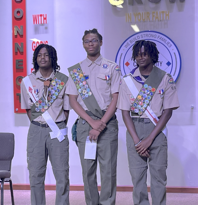 Twins Khalif and Khalil Morehead, and Sultan Al-Uqdah Jr. iin the middle, are now Eagle Scouts.