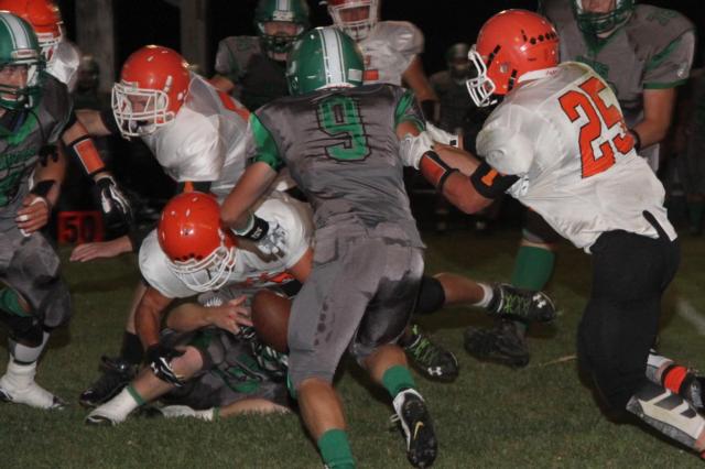 A Greenfield-Northwestern loose ball ends up in the hands of a Hawk, which set up a Carrollton score. Scrambling for the ball are Carrollton’s #9 Brody Howard, #2 Cole Brannan and #4 Jerrett Smith. Tigers in the mix are #5 Blane Bilbruck, #25 Taegan Grigsby and #40 Jacob Foiles. (Photos courtesy of Sherry Fraley Photography)
