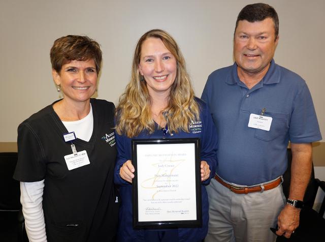 Jody Crowe, center, honored as Employee of the Month 