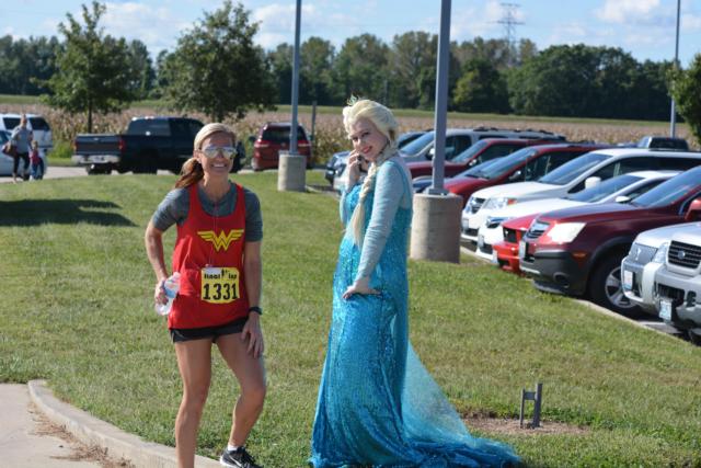 Greenfield's Shannon Cole, the winner of the 10K female race, with another in costume.