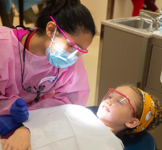 A child receives free dental care during the 2019 Give Kids a Smile Day event at the SIU School of Dental Medicine.