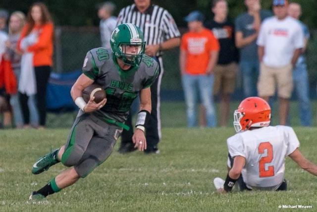 Alex Bowker catches a pass and runs for yards against Greenfield-Northwestern. Photo curtesy of Mike Weaver.