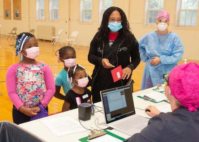 Checking in at the SIU SDM for the 2020 Give Kids a Smile Day are mom Tarshaee Turner and children (L-R) Tarjayee, Tarmajae and Taliyiah.