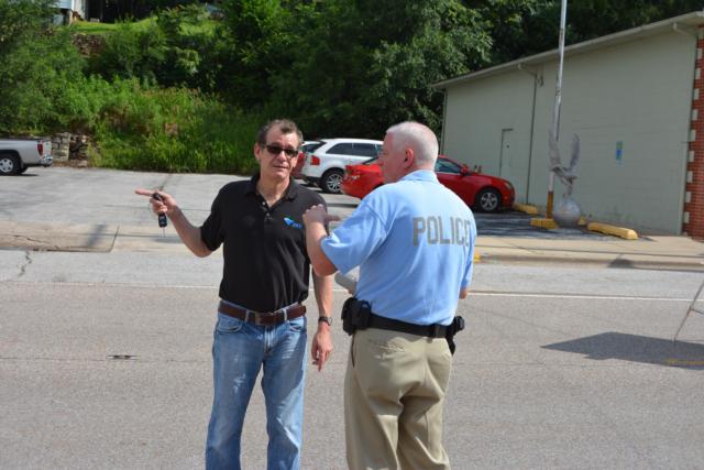Chris Sullivan interacts with someone in Grafton in the photo, much like he did each day on the job in the community.