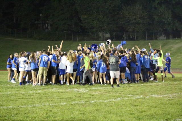 The Blue Crew rushed out on the field after the Explorers' victory against Pawnee to celebrate. 