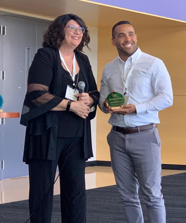 Madison County Resource Management Coordinator Brandon Banks accepts an “Outstanding Public Sector Recycling Program” award from Illinois Recycling Foundation President Marta Keane during its annual conference in late August in Joliet.