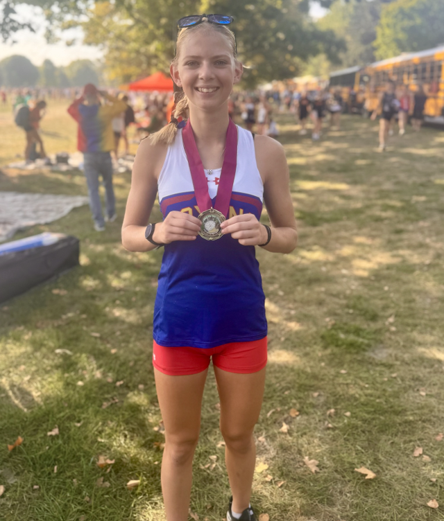 Gianna Stassi with her medal after her top performance at the Peoria Meet.
