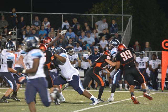 Edwardsville's A.J. Epenesa (No. 99) is shown on a sack on Friday night against Belleville East. Epenesa had his best game of the season against the Lancers. He blocked a field goal, had a scoop and score for 52 yards and was all over the field with his defensive partner, Desmond Chapple. (Photo by Dan Brannan). 