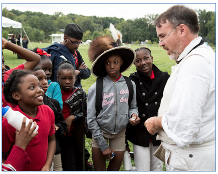 Fifth grade students from Mason/Clark Middle School in East St. Louis, Illinois, learn about the Lewis and Clark Expedition during the 14th Annual Water Festival at Lewis and Clark Community College Sept. 30. Photo by Louise Jett, L&C media specialist