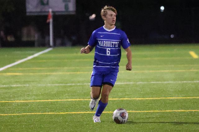 Senior midfielder Jackson Pranger dribbles the ball up field for the Explorers. 
